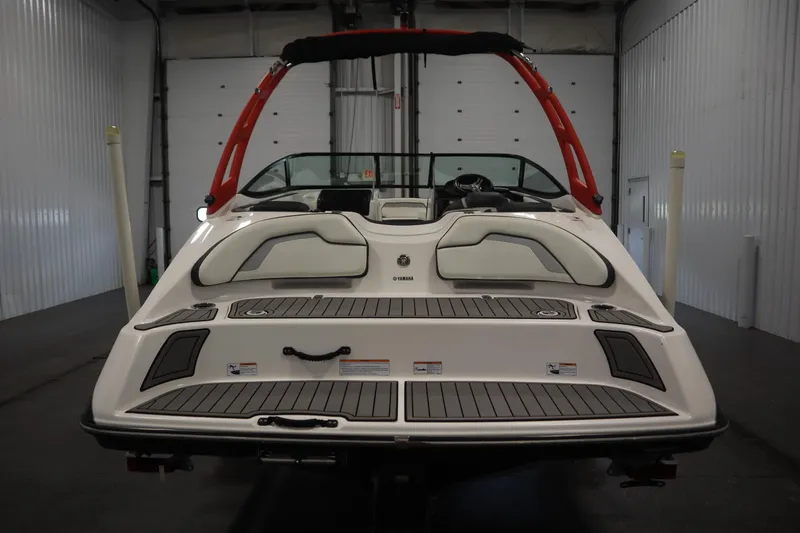 Slide: The Image of 2018 Yamaha AR195 boat in a garage, rear view with red accents. - 6