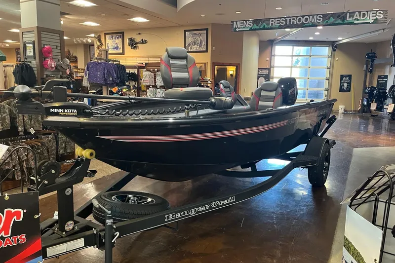 Slide: The Image of 2024 Ranger VS1665T boat displayed indoors with Minn Kota PowerDrive motor. - 1