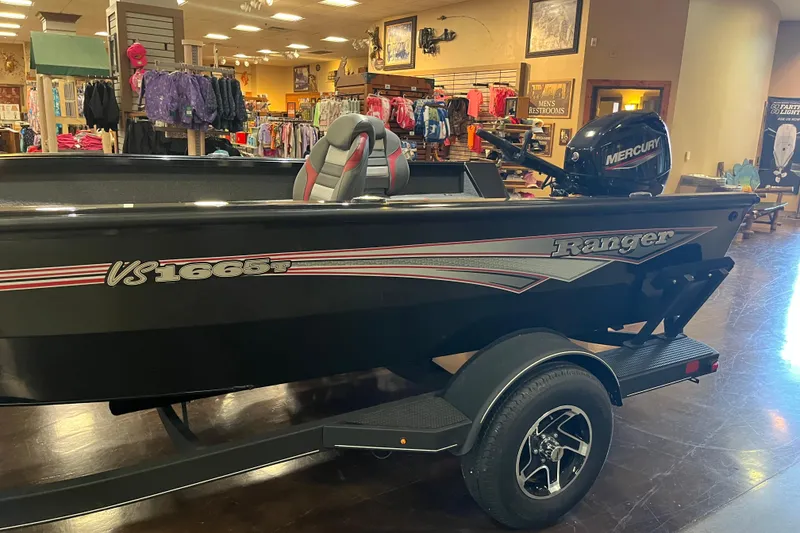 Slide: The Image of 2024 Ranger VS1665T boat displayed indoors with Mercury engine. - 3