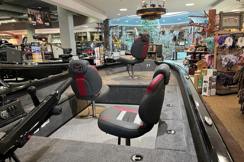 Slide: The Image of 2024 Ranger VS1665T boat interior with seating, displayed in a showroom setting. - 4