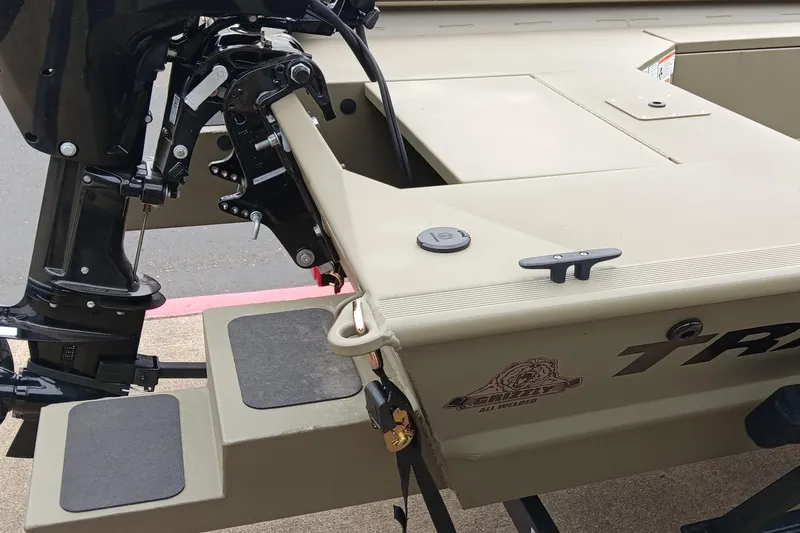 Slide: The Image of 2026 Tracker Grizzly 1654 T Sportsman boat, featuring a sturdy motor and all-welded design. - 4