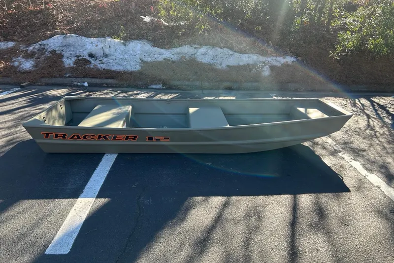The Image of 2026 Tracker Grizzly 12 Jon boat parked on asphalt under sunlight. - 0