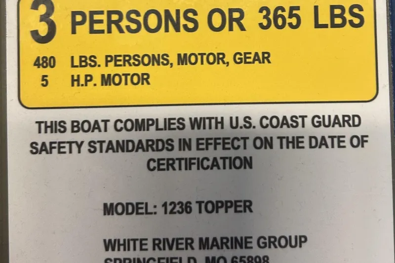 Slide: The Image of Capacity label for 2026 Tracker Grizzly 12 Jon boat, 3 persons or 365 lbs, 5 HP motor. - 13