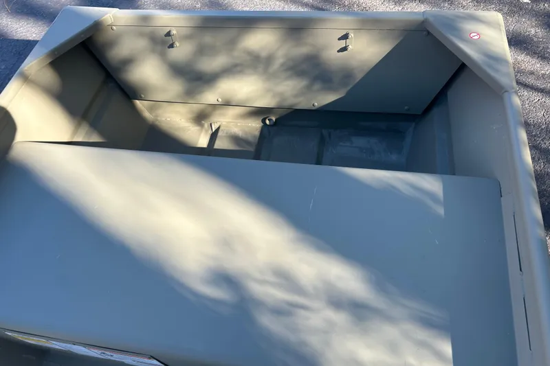 Slide: The Image of 2026 Tracker Grizzly 12 Jon boat interior with shadow patterns on the surface. - 5