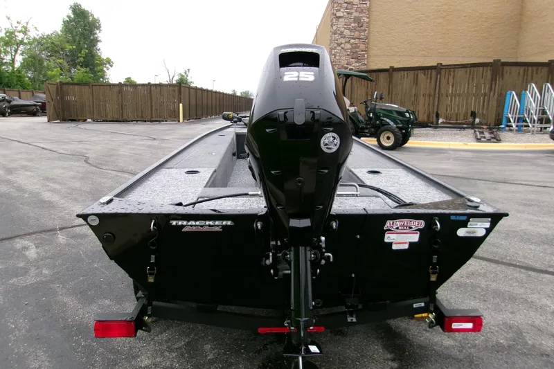 Slide: The Image of 2025 Tracker Panfish 17 boat with 25 HP motor, parked outdoors. - 3