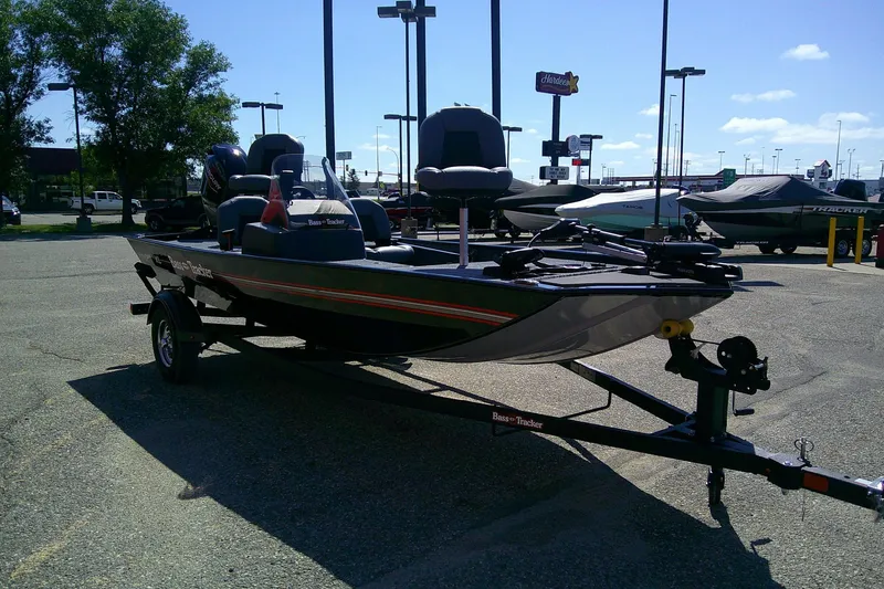 Slide: The Image of 2026 Tracker Bass Tracker Classic XL boat on trailer in parking lot. - 62