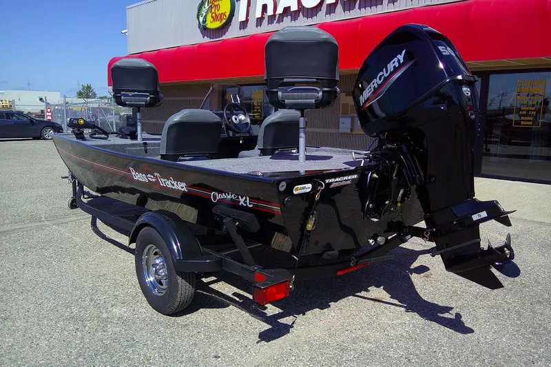 Slide: The Image of 2026 Tracker Bass Tracker Classic XL boat with Mercury engine at dealership. - 64