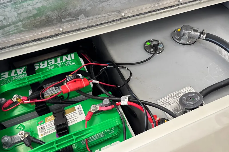 Slide: The Image of Battery compartment of 2025 Tracker Pro Team 175 Crappie Edition boat, showing wiring and connections. - 34