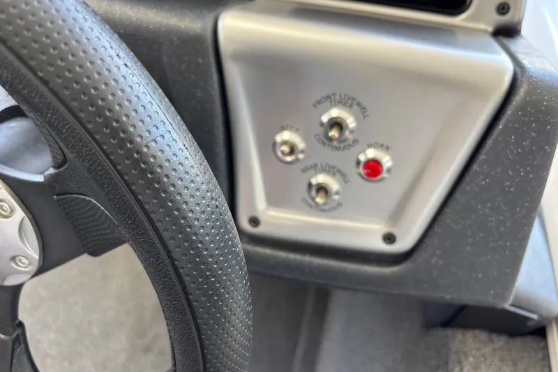 Slide: The Image of Steering wheel and control panel of 2025 Tracker Pro Team 175 Crappie Edition boat. - 22