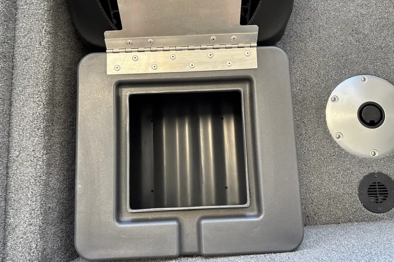Slide: The Image of Storage compartment on 2025 Tracker Pro Team 175 Crappie Edition boat, open lid view. - 25