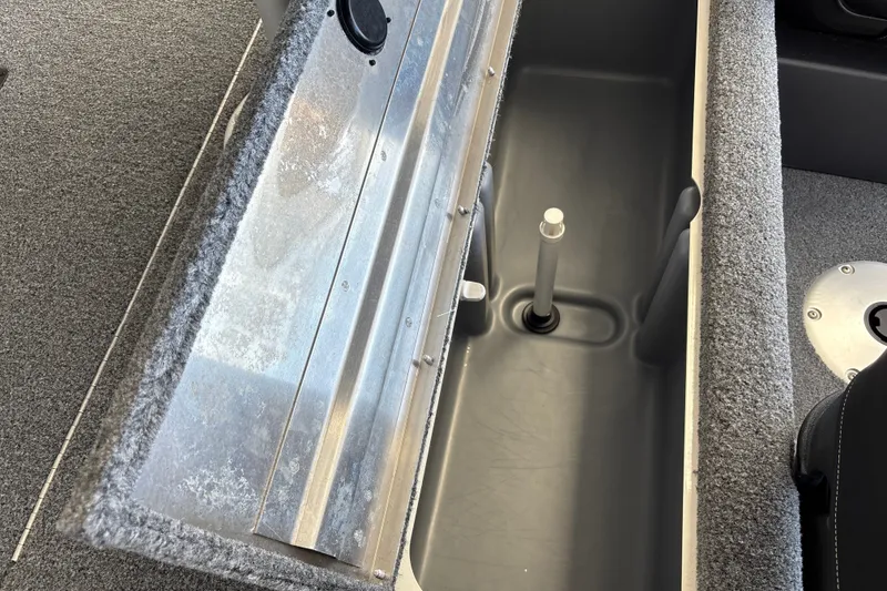Slide: The Image of Interior view of 2025 Tracker Pro Team 175 Crappie Edition boat, featuring storage compartment. - 28