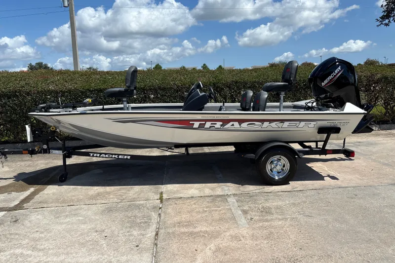 The Image of 2025 Tracker Pro Team 175 Crappie Edition boat on trailer, parked outdoors. - 0