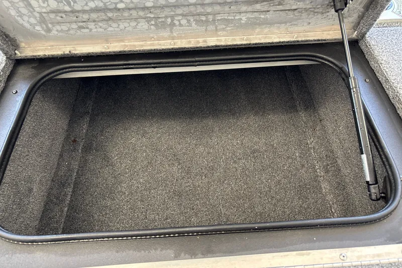 Slide: The Image of Open storage compartment in 2025 Tracker Pro Team 175 Crappie Edition boat. - 31