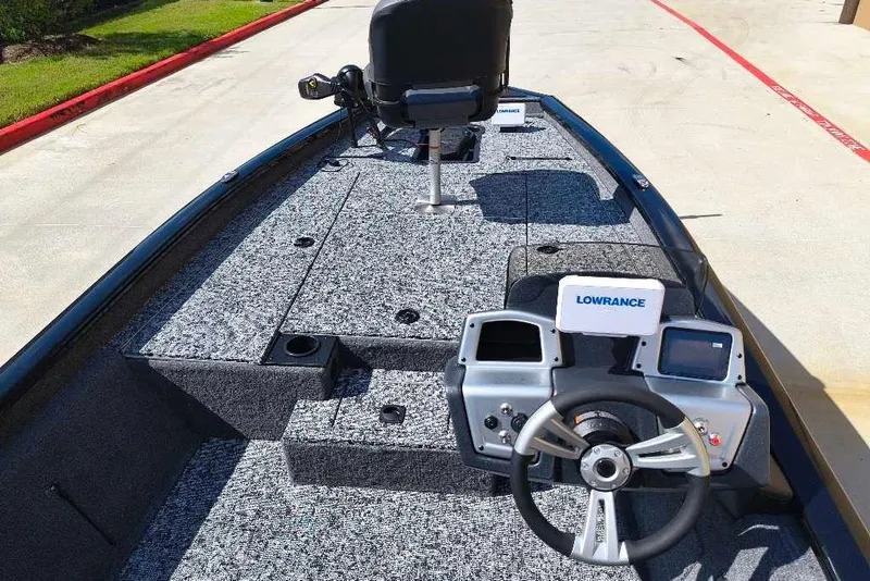 Slide: The Image of 2026 Tracker Pro Team 190 boat interior with steering wheel and navigation system. - 4