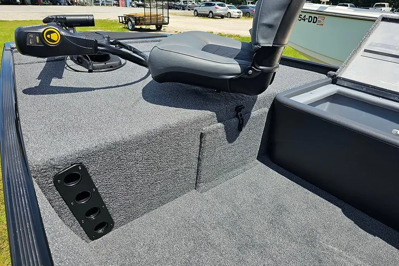 Slide: The Image of 2026 Tracker Bass Tracker Classic XL boat interior with seating and control panel. - 12