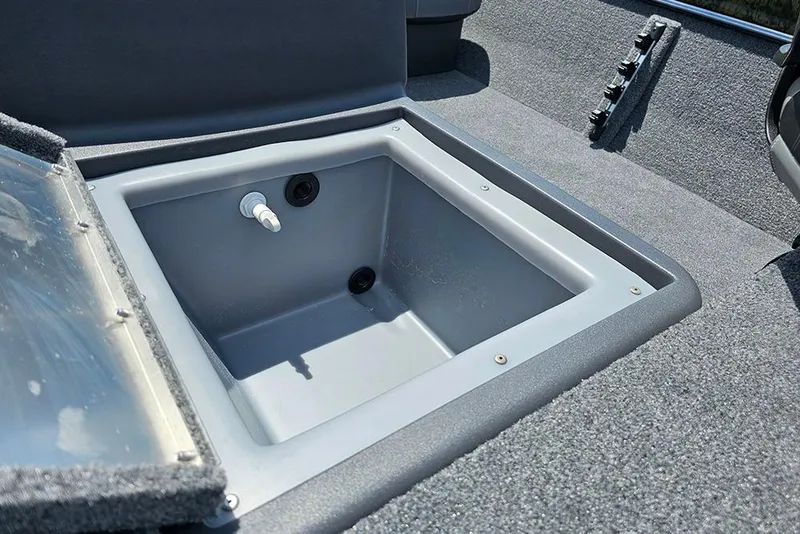 Slide: The Image of 2026 Tracker Bass Tracker Classic XL livewell with open lid, showcasing interior features. - 14