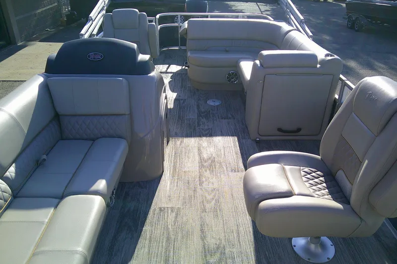 Slide: The Image of 2024 Ranger Reata 220FC boat interior with luxurious seating and modern design. - 2