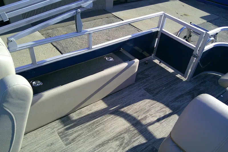 Slide: The Image of 2024 Ranger Reata 220FC boat interior with seating and railing, showcasing modern design. - 8
