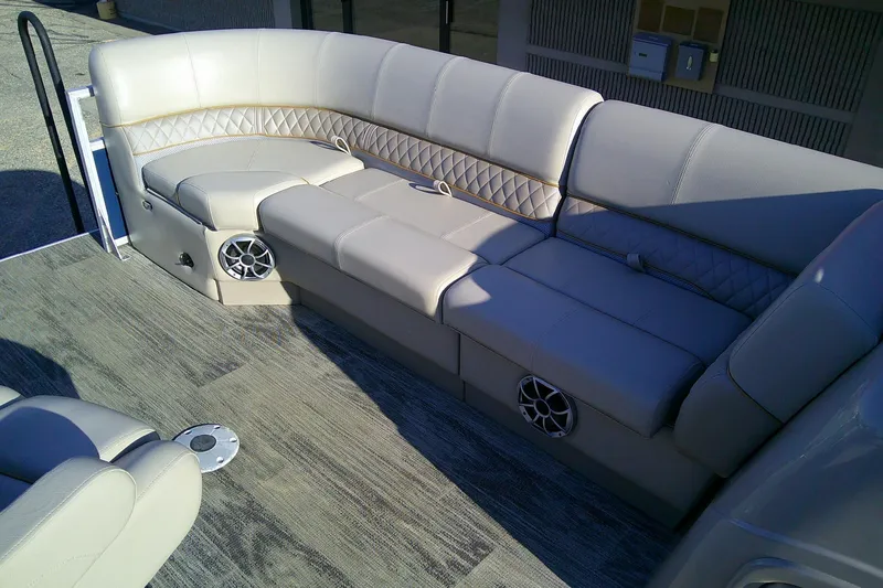 Slide: The Image of Luxurious seating on 2024 Ranger Reata 220FC boat with stylish upholstery and built-in speakers. - 85