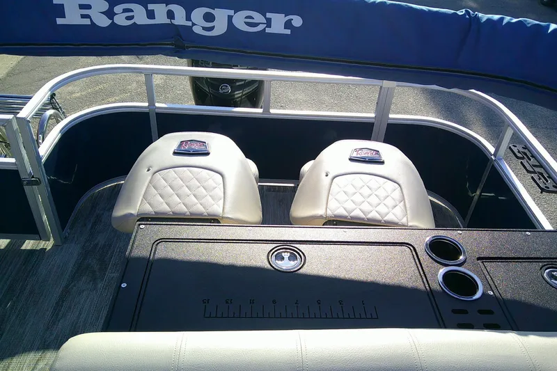Slide: The Image of 2024 Ranger Reata 220FC boat interior with seating and fishing station. - 86