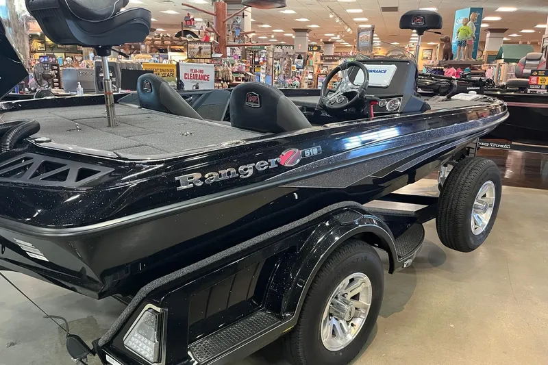 Slide: The Image of 2024 Ranger Z518 Ranger Cup Equipped boat displayed indoors, showcasing sleek design and features. - 3