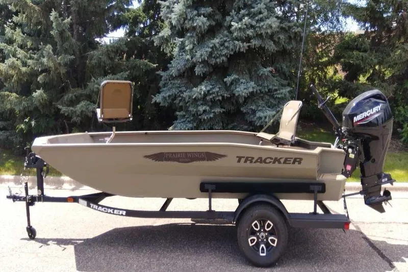 Slide: The Image of 2026 Tracker Grizzly 1650 T Prairie Wings Edition boat on trailer, outdoors. - 6