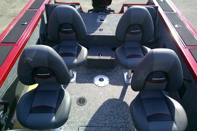 Slide: The Image of 2026 Tracker Targa V-18 Combo boat interior with four gray seats. - 10