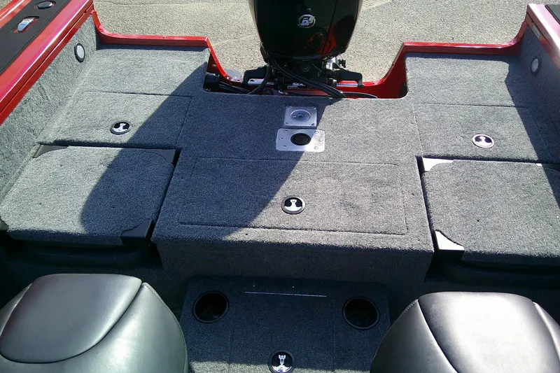 Slide: The Image of 2026 Tracker Targa V-18 Combo boat interior with carpeted deck and seating. - 13