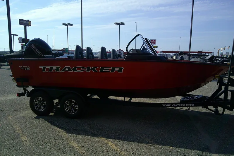 Slide: The Image of 2026 Tracker Targa V-18 Combo boat in parking lot, red exterior, on trailer. - 4
