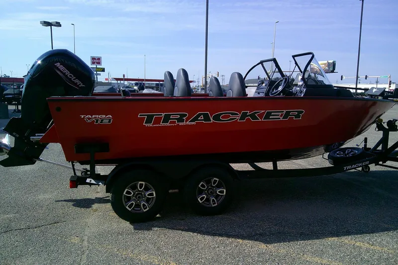 Slide: The Image of 2026 Tracker Targa V-18 Combo boat on trailer in parking lot. - 5