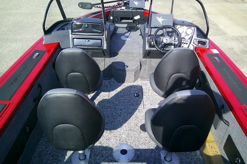 Slide: The Image of 2026 Tracker Targa V-18 Combo boat interior with four seats and modern dashboard. - 6