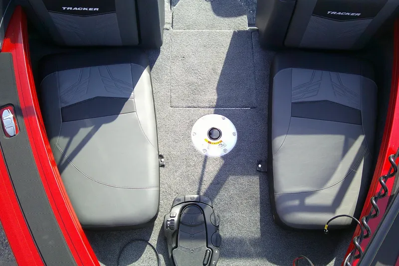 Slide: The Image of Interior of 2026 Tracker Targa V-18 Combo boat with gray seats and red accents. - 9