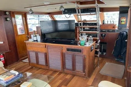 Slide: The Image of 1985 Chris-Craft 500 Constellation yacht interior with wooden decor and modern amenities. - 11