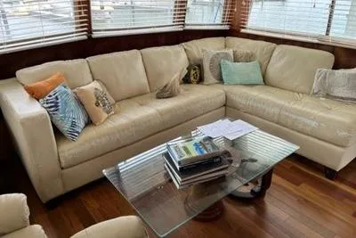 Slide: The Image of Luxurious interior of 1985 Chris-Craft 500 Constellation yacht with cream leather sofa and glass table. - 15