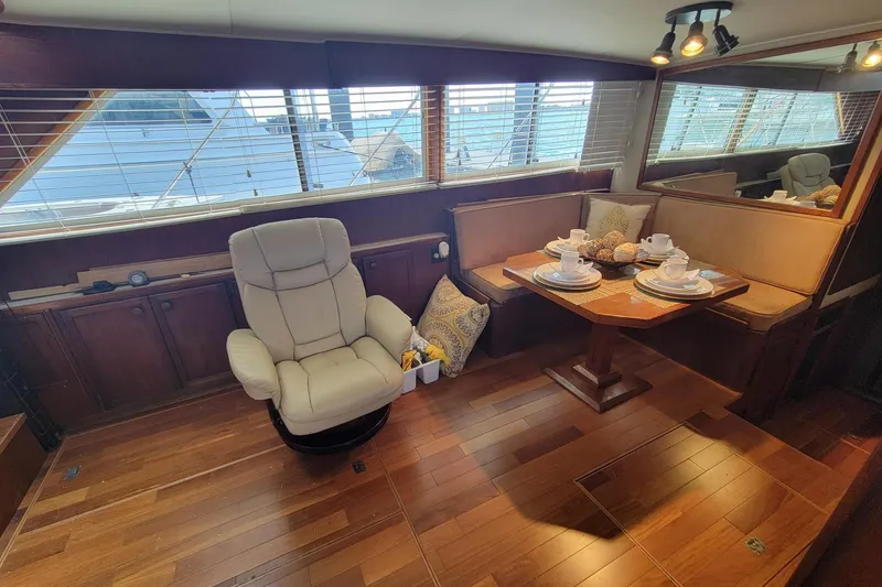 Slide: The Image of Luxurious interior of 1985 Chris-Craft 500 Constellation yacht with elegant seating and dining area. - 19