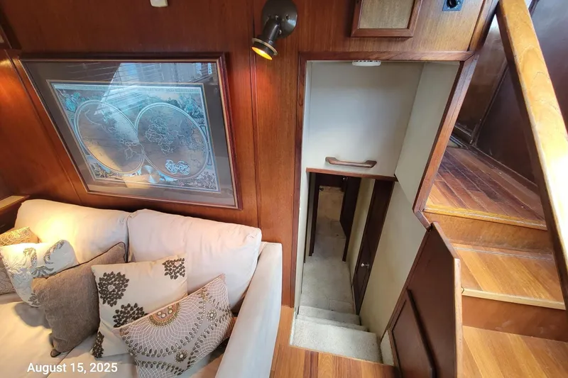 Slide: The Image of Interior of 1985 Chris-Craft 500 Constellation yacht with cozy seating and wooden stairs. - 24