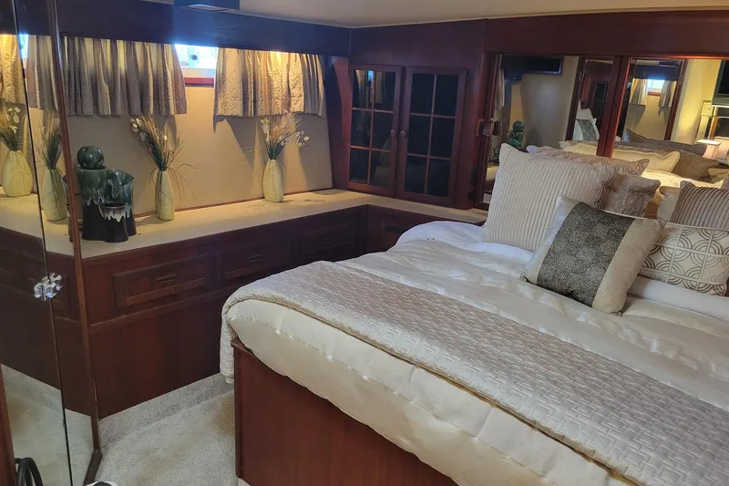 Slide: The Image of Luxurious bedroom interior of 1985 Chris-Craft 500 Constellation yacht with elegant decor. - 29