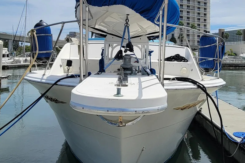 Slide: The Image of 1985 Chris-Craft 500 Constellation yacht docked at marina, front view. - 3