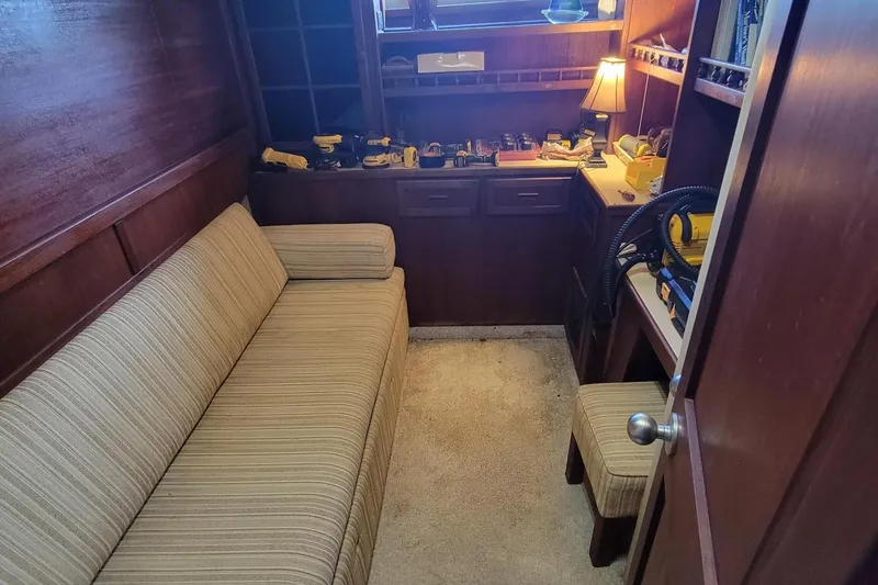 Slide: The Image of Cozy interior of 1985 Chris-Craft 500 Constellation with sofa and workbench. - 36