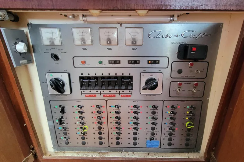 Slide: The Image of Control panel of a 1985 Chris-Craft 500 Constellation yacht with various switches and gauges. - 44