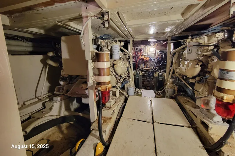 Slide: The Image of Engine room of 1985 Chris-Craft 500 Constellation yacht, showcasing mechanical components. - 46