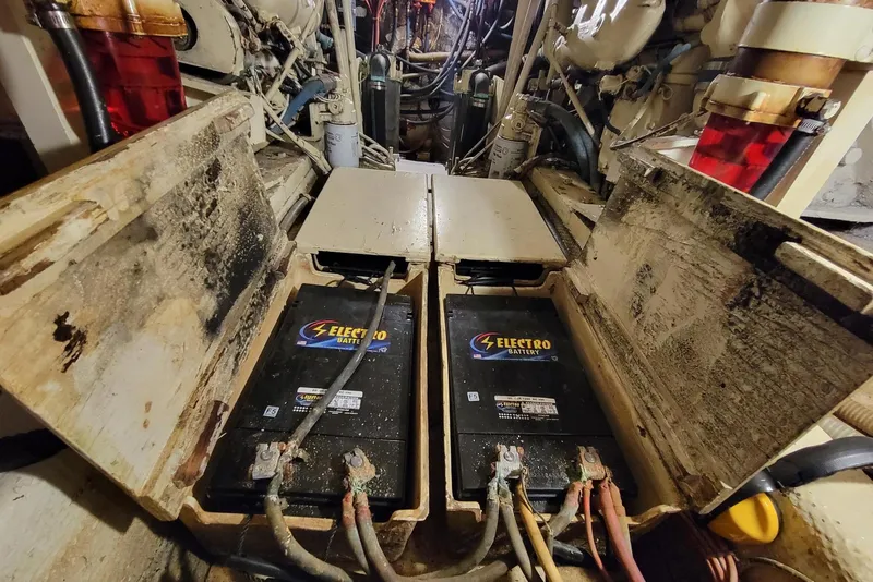Slide: The Image of 1985 Chris-Craft 500 Constellation engine room with Electro batteries and wiring. - 48