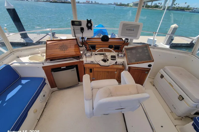 Slide: The Image of Helm of 1985 Chris-Craft 500 Constellation yacht with navigation equipment and seating. - 5