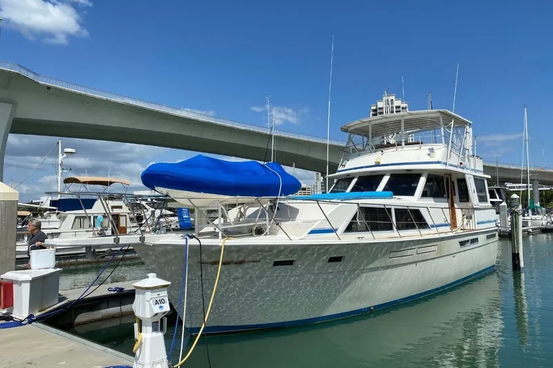 Slide: The Image of 1985 Chris-Craft 500 Constellation yacht docked at marina under clear blue sky. - 65