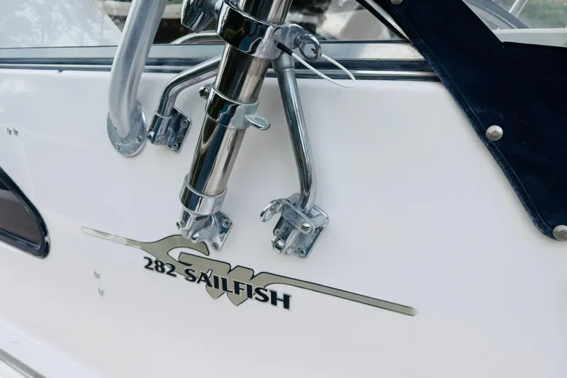 Slide: The Image of 2003 Grady-White Sailfish 282 boat detail with chrome fittings and logo. - 12
