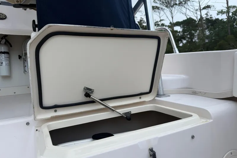 Slide: The Image of Open storage compartment on 2003 Grady-White Sailfish 282 boat deck. - 13
