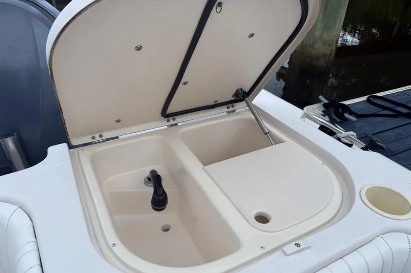 Slide: The Image of Open storage compartment on 2003 Grady-White Sailfish 282 boat, showing interior details. - 15