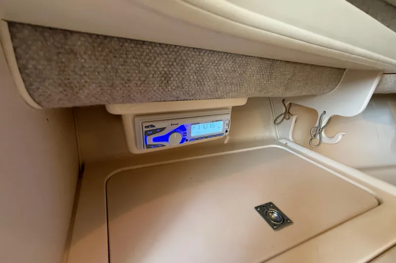Slide: The Image of 2003 Grady-White Sailfish 282 cabin interior with radio and storage hooks. - 26