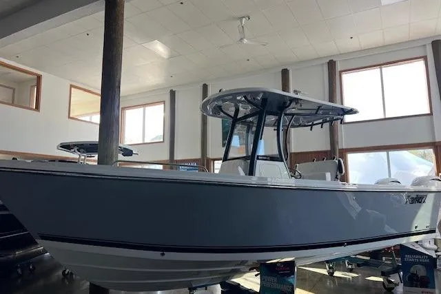 The Image of 2025 Parker 2600 Center Console boat displayed indoors, showcasing sleek design and modern features. - 0