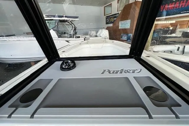 Slide: The Image of 2025 Parker 2600 Center Console boat interior with compass and logo. - 16